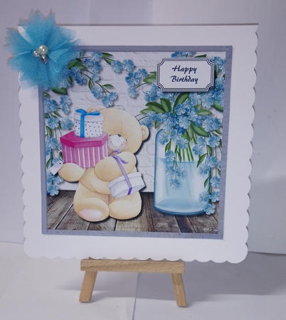 Forever friends bear with blue flowers by Jackie Odonnell