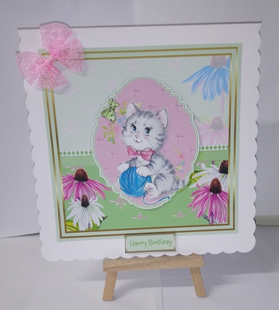 Cute kitten with a ball of wool by Jackie Odonnell