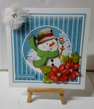 Snowman and poinsettia by Jackie Odonnell