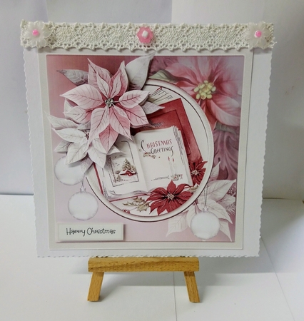 Christmas book and poinsettias by Jackie Odonnell