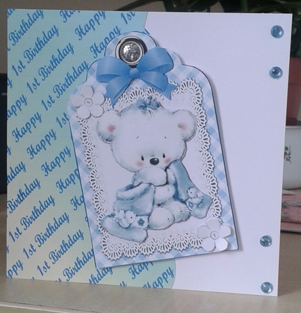 Little white teddy cuddling blanket on lace blue gingham tag by Jane Appleton-Lowles