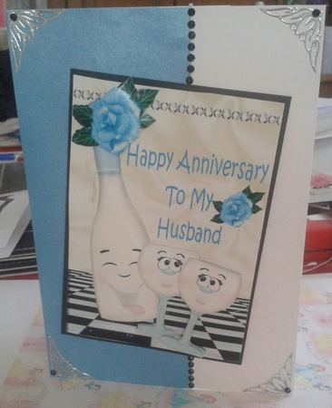 Happy Anniversary to my HUSBAND with blue roses & toony champagne A5 by Jane Appleton-Lowles