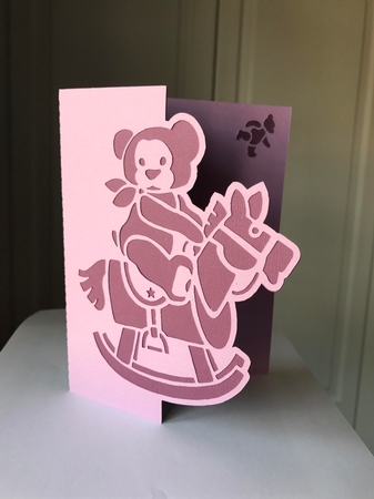 Rocking Horse Teddy Over The Edge Card by Jane Amber