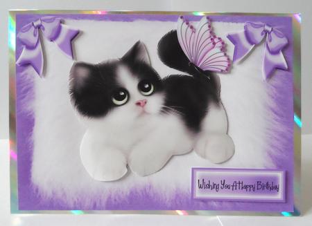 Cute Kitten on Fur, with Bows and Butterflies by Jean-Marie Penny