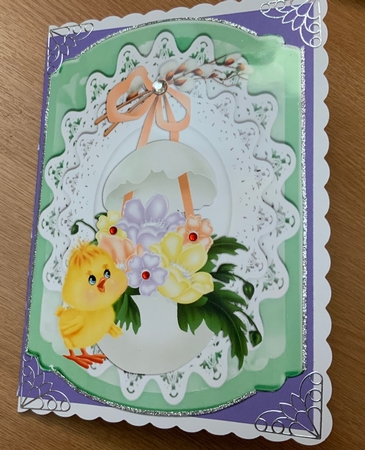 Pretty spring chick with easter egg, flowers on lace bracket card by Jennie Settle