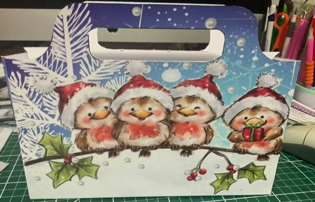 Cute robins in santa hats on a branch tote bag by Jennie Settle