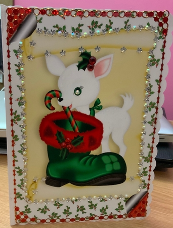 Cute White Deer on a Scroll with Santa Boot A4 by Jennie Settle