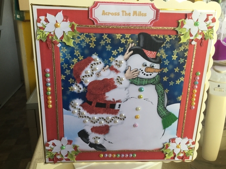 Dressing The Snowman  by Jennie Settle