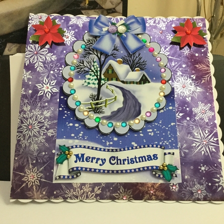 Lovely snow scene with cottage, and  lilac bow over the edge by Jennie Settle
