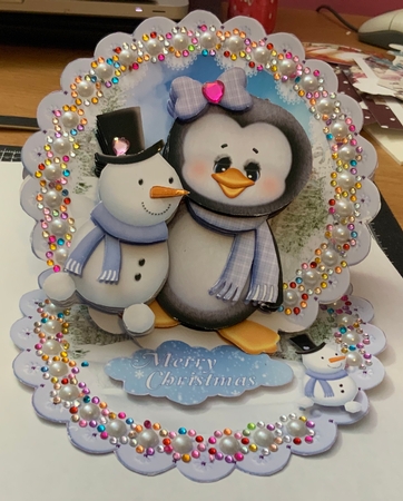 Cute Little Penguin and Snowman Scalloped Round Easel Card by Jennie Settle