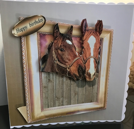 horses in a frame  by Jennie Settle