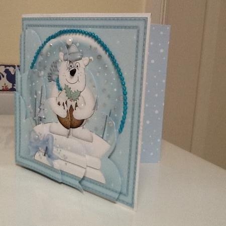 Christmas Snowglobe Ben Polar Bear has a Christmas Pudding Shell Edged Corner Stacker by Jennifer Purdon