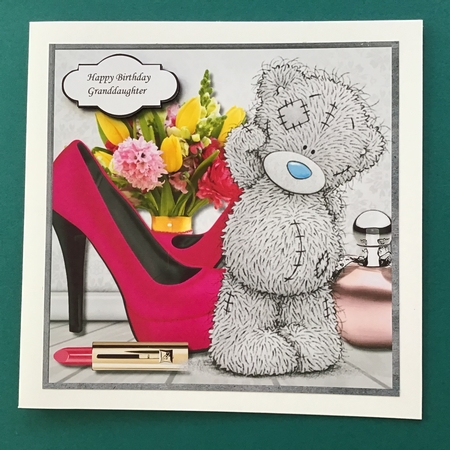 Tatty teddy with flowers, perfume and shoes by Jennifer Archer