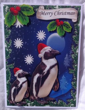 Penguins in the Snow Wearing Santa Hats with Holly by Jennifer Archer