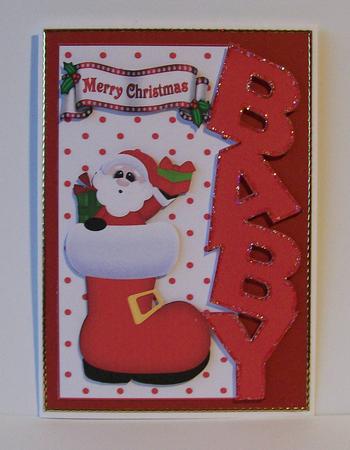 Santa in His Stocking Over the Edge for Baby by Joan Mary Smith