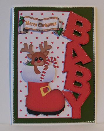 Rudey in Santa Boot Over the Edge for Baby by Joan Mary Smith