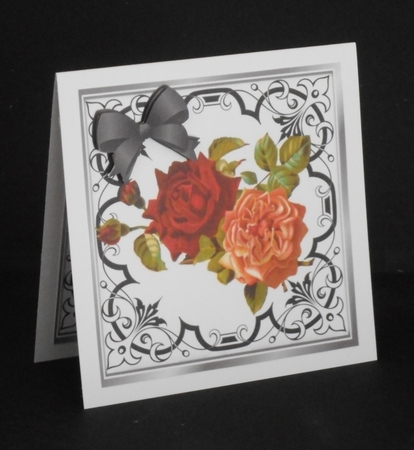 Pretty red/peach roses in ornate black scroll 8x8 frame by Joan Prince