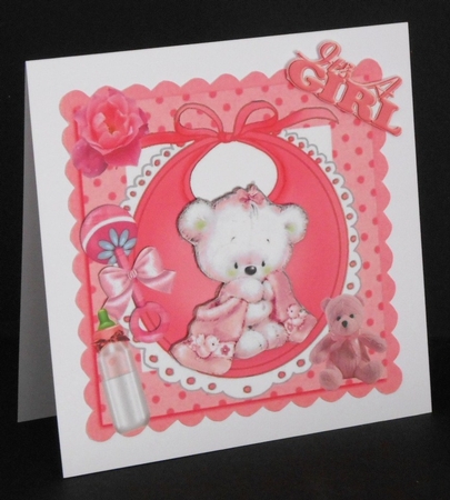 cute teddy with her pink blanket, bottle on bib in frame 8x8 by Joan Prince