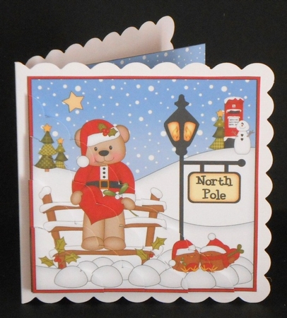 Christmas Livvy Bear is at the North Pole Scalloped Corner Stacker by Joan Prince