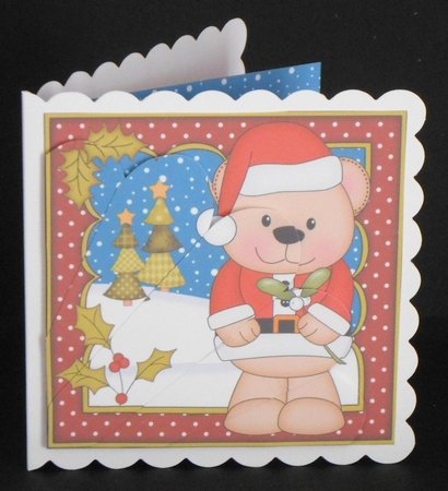 Christmas Livvy Bear has the Mistletoe Fan Pyramage Topper by Joan Prince