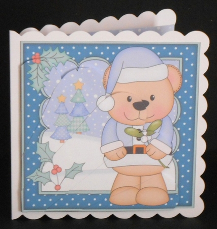 Christmas Livvy Bear has the Mistletoe Fan Pyramage Topper by Joan Prince