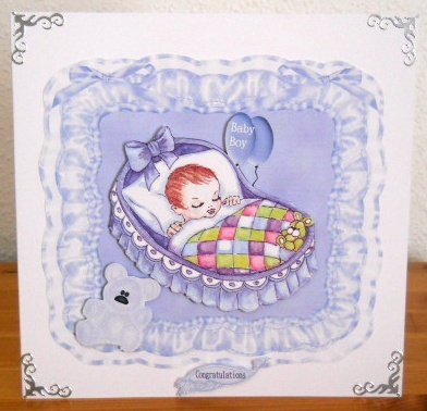 New Baby Boy in Cot by Joan Prince