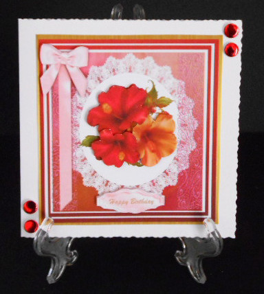 Lovely Hibiscus on a Lace Mat by Joan Prince
