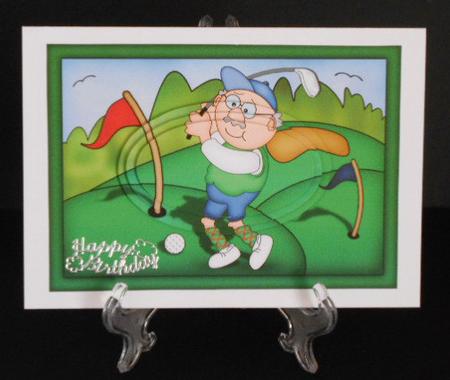 A5 Old Man Bert Plays Golf Oval Pyramage Topper by Joan Prince