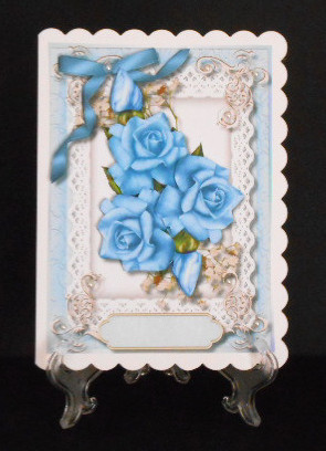 Beautiful Blue Roses and Baby's Breath on Lace  by Joan Prince