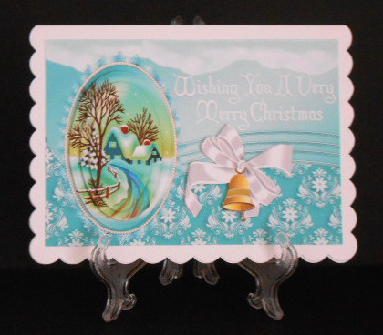 Pretty Snow Scene with Cottage & Bells Oval Pyramids by Joan Prince