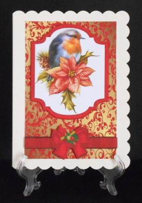 Robin on a Plaque with Poinsettias and Bow by Joan Prince