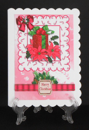 Present with Pink Poinsettias and Bow by Joan Prince