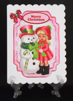 Snowman with Little Girl Dressed in Pink by Joan Prince