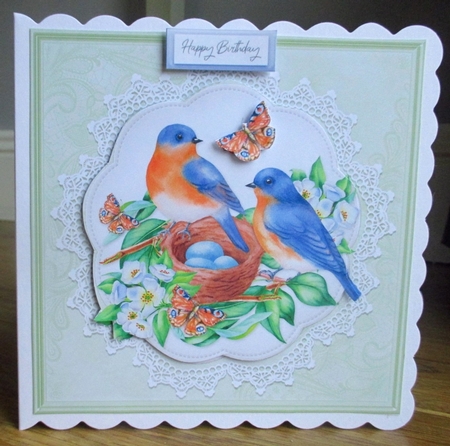 Lovely Birds Nest Floral Topper by Johanna Lambert