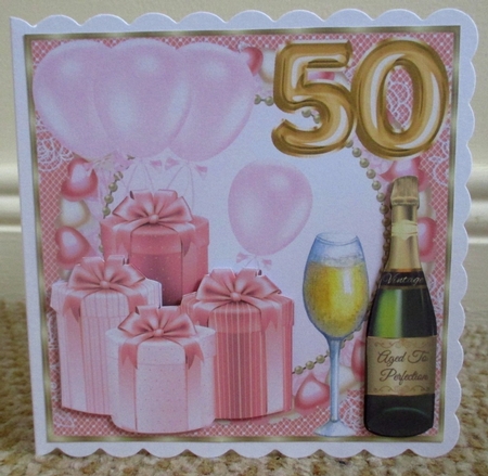 Pink age 50 balloons and presents card front by Johanna Lambert