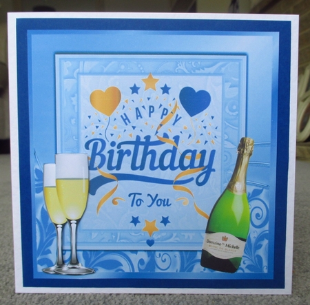 Lovely Birthday celebration  card front with wine (blue) 8x8 by Johanna Lambert