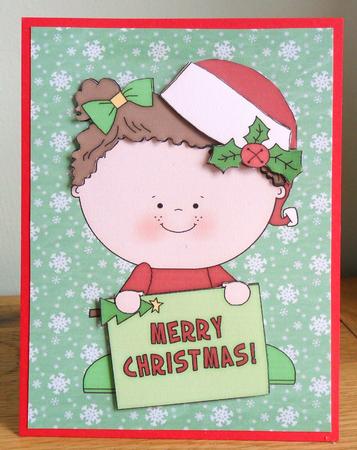 Little Christmas Girl with Merry Christmas Sign by Johanna Lambert