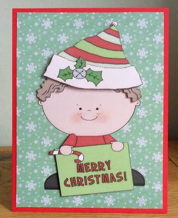 Cute Christmas Elf with Merry Christmas Sign by Johanna Lambert