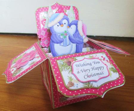 Christmas Kissing Penguins Pop Up Box Card 7.5" by Johanna Lambert