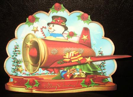 Cute Christmas Snowman in Airplane by Johanna Lambert