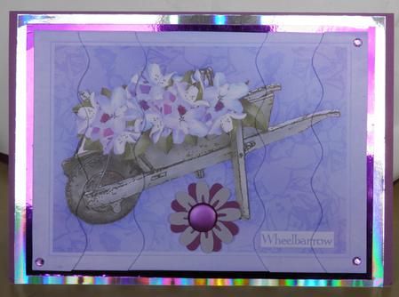 Flower Filled Wheelbarrow Wavey Edged Side Stacker by Jose Hopkins