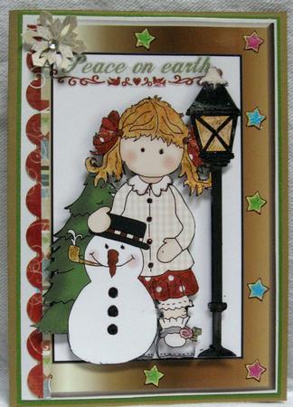 Little Girl in Star Frame with Snowman by Joy Comstock