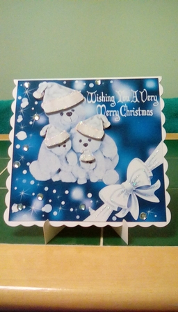 Cuddly teddies in silver santa hats with corner bow 8x8 by Joyce Edwards