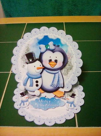Cute Little Penguin and Snowman Scalloped Round Easel Card by Joyce Edwards