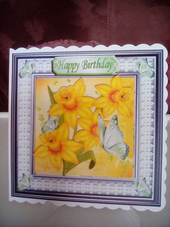 Pretty yellow daffodils in pyramids with lace 7x7 frame by Joyce Edwards