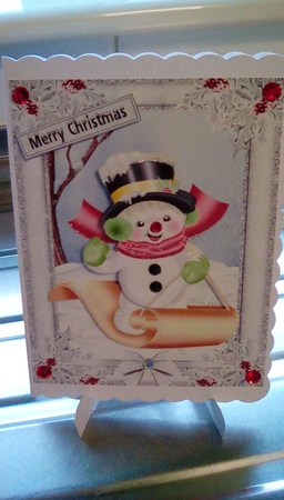 Snowman Enjoying a Ride by Joyce Edwards