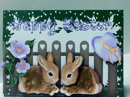 Easter Bunnies with Bonnet and Flower by judy borutski