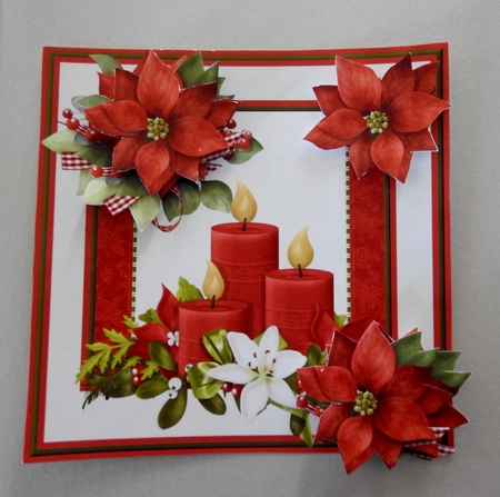 Christmas candles and poinsettia by Julianne Harris
