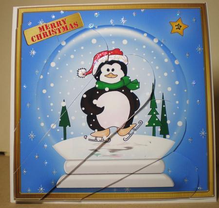Skating Penguin Snowglobe Fan Pyramage Topper by Julie Hart