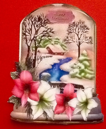 pretty glass snow dome with scenery and floral arrangement by Julie McGregor